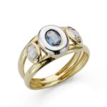 18K SORTIJA ORO BICOLOR PIEDRA DOBLE CUERPO CON CIRCONITA AGUAMARINA OVAL EN BOCEL, ANCHO: 10 MM
