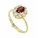 18K SORTIJA ORO AMARILLO CUAJO GRANATE 7X5 MM Y CIRCONITAS,