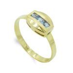 18K SORTIJA ORO AMARILLO CON CIRCONITA AGUAMARINA TALLA BAGUETTE, ANCHO: 7,5 MM